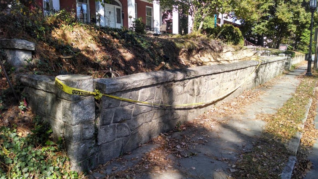 Retaining wall leaning toward sidewalk at 110 S. Mendenhall