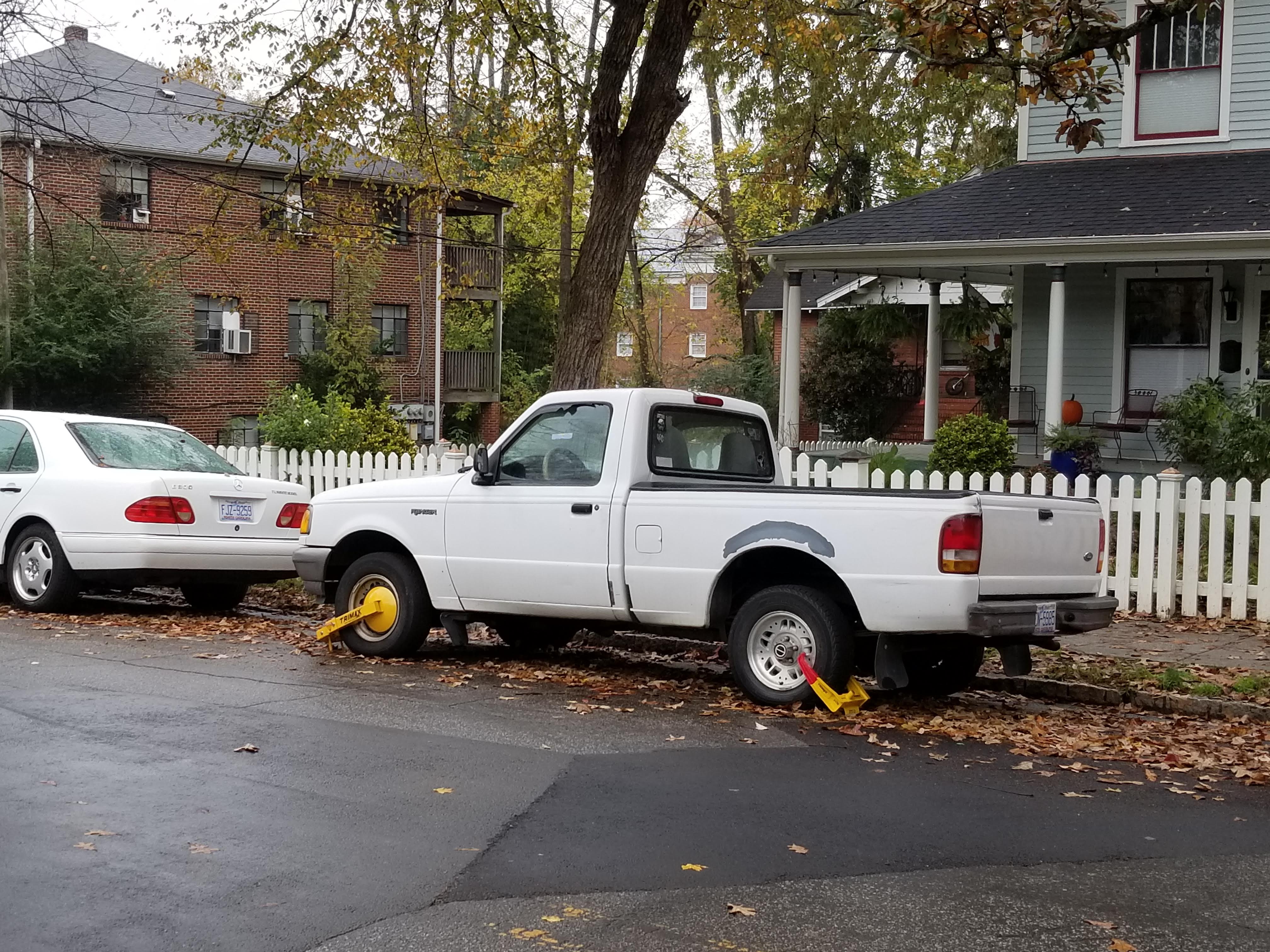 pickup truck with not one but two Denver boots on it