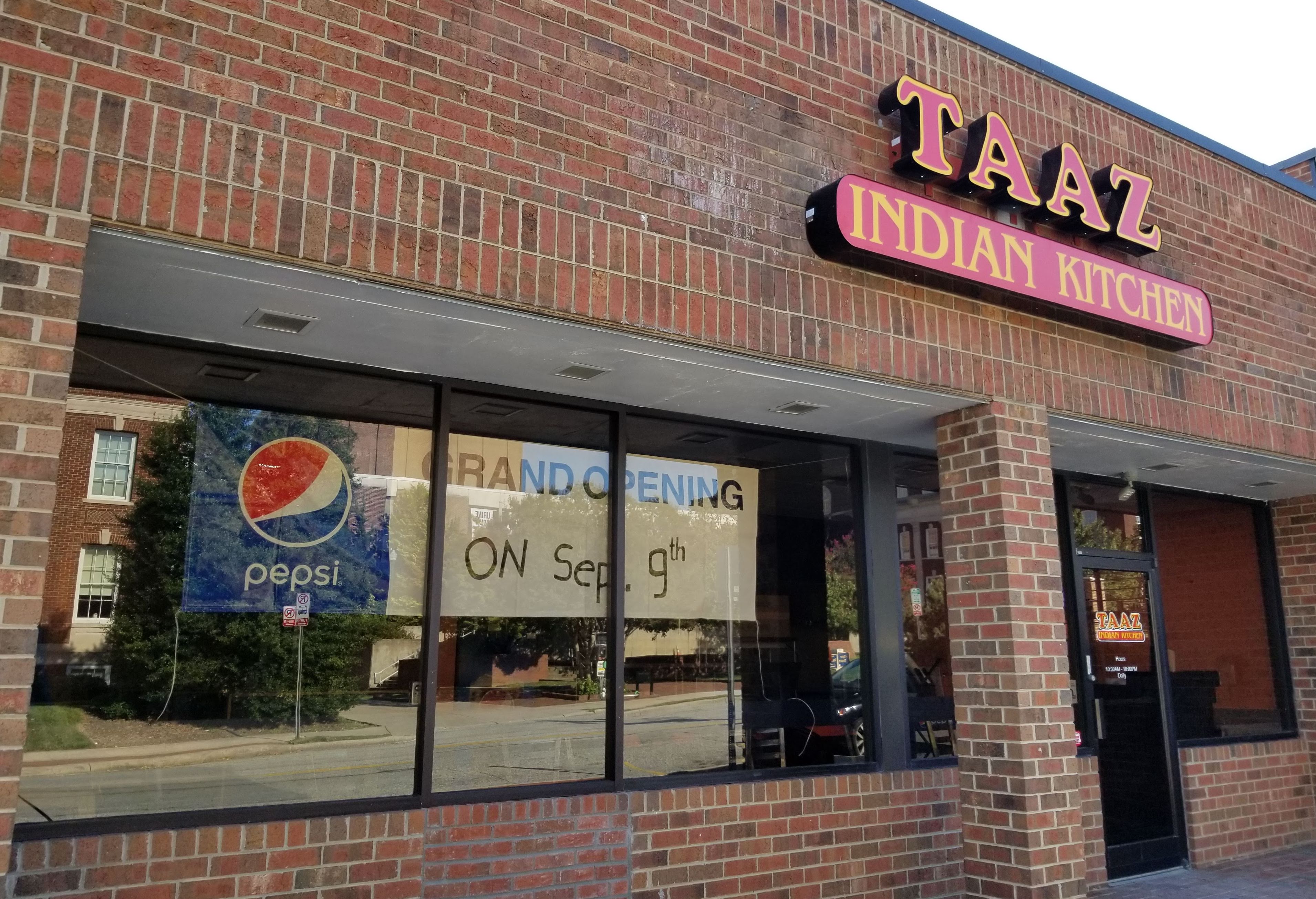 view from sidewalk of taaz indian kitchen
