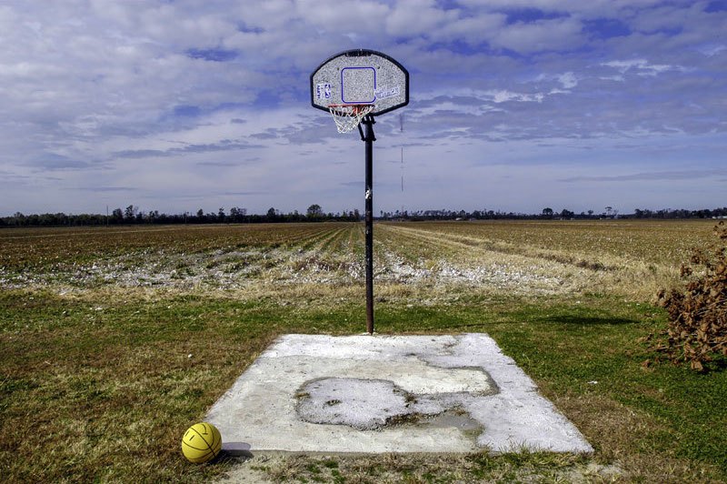 small basketball court in a farm field