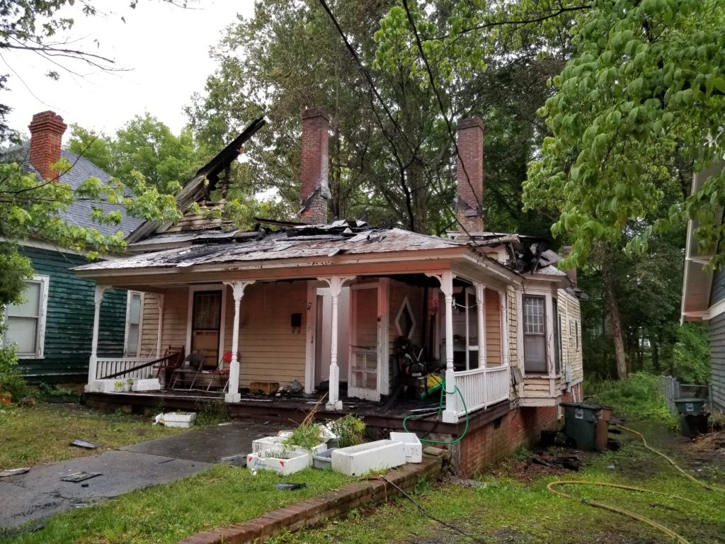 923 Carr Street with its roof burned away after the fire